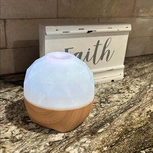 White and Wood Grain Essential Oil Diffuser made by Lomi with Bluetooth speaker